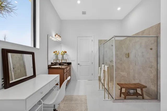 a view of a house with a big yard and potted plants