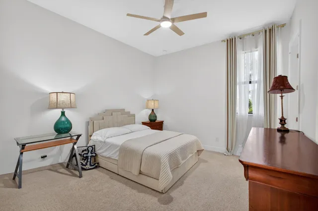 an aerial view of a swimming pool with outdoor seating