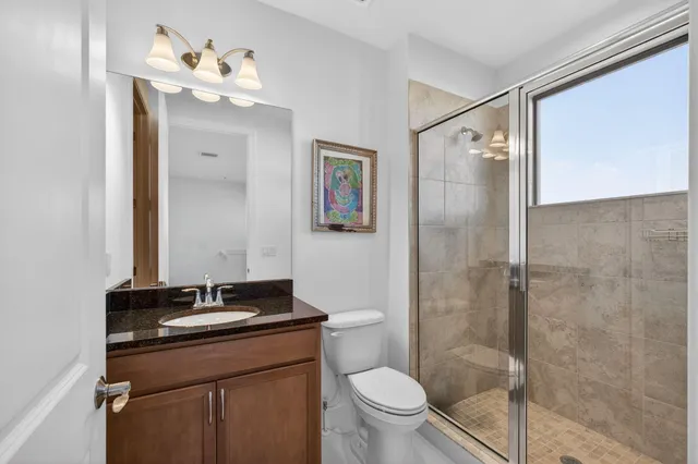 a room with pool table and windows