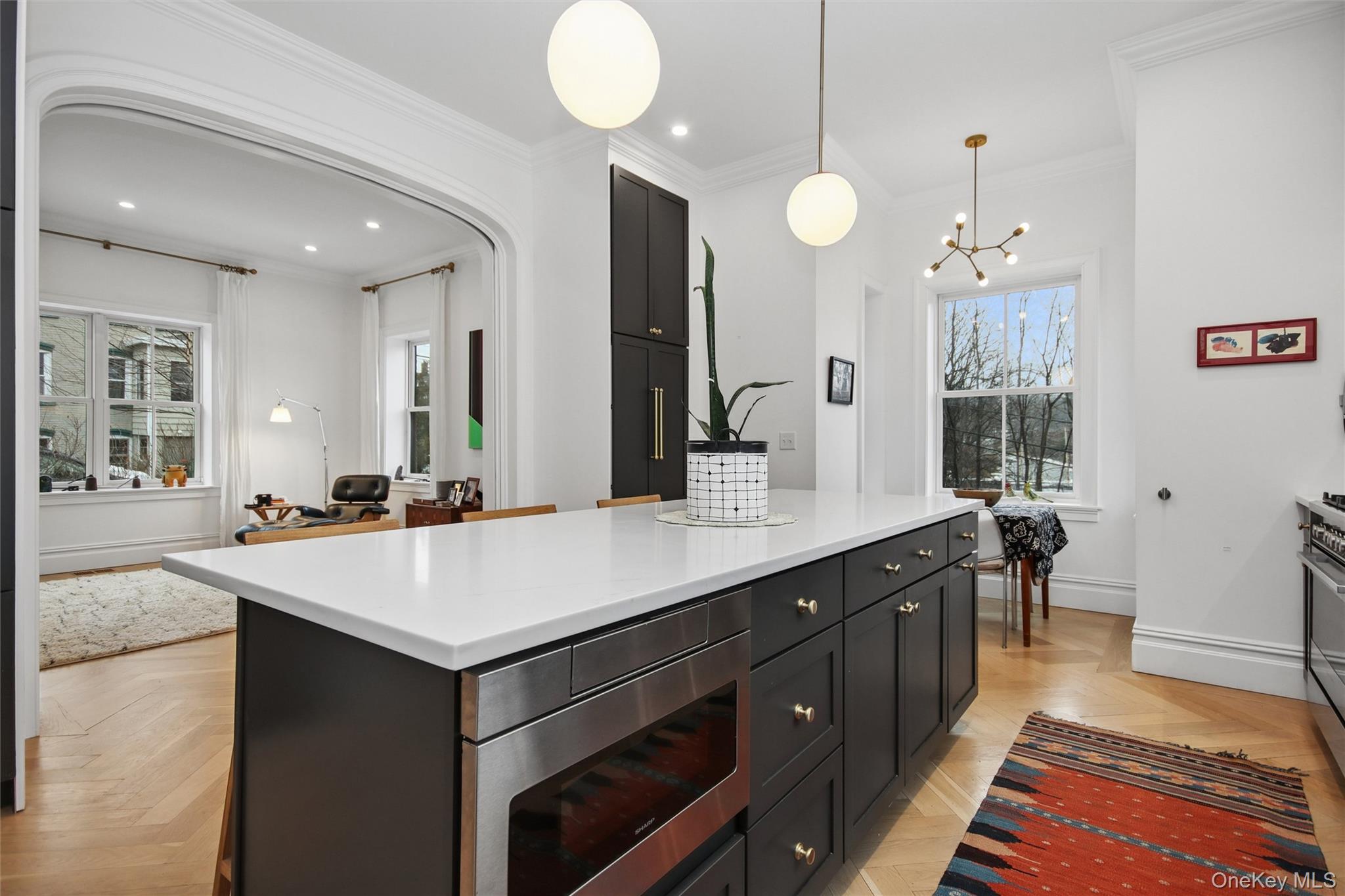 33 Davis Street Beacon, NY 12508 - Photo 13 of 46 a view of a kitchen island a chandelier and living room view