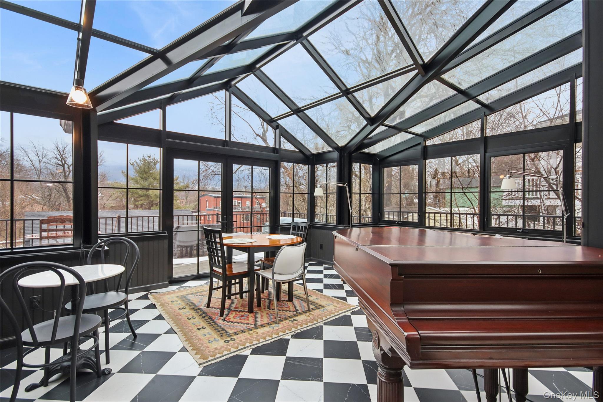 33 Davis Street Beacon, NY 12508 - Photo 20 of 46 a dining room with furniture a rug and a large window