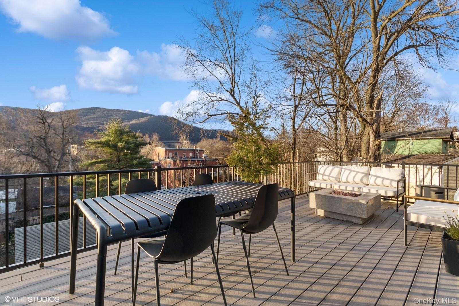 33 Davis Street Beacon, NY 12508 - Photo 21 of 46 a view of a chairs and tables in the balcony