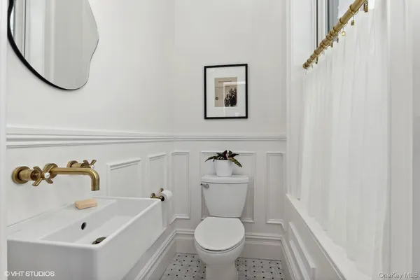 a bathroom with a sink a toilet and a bathtub