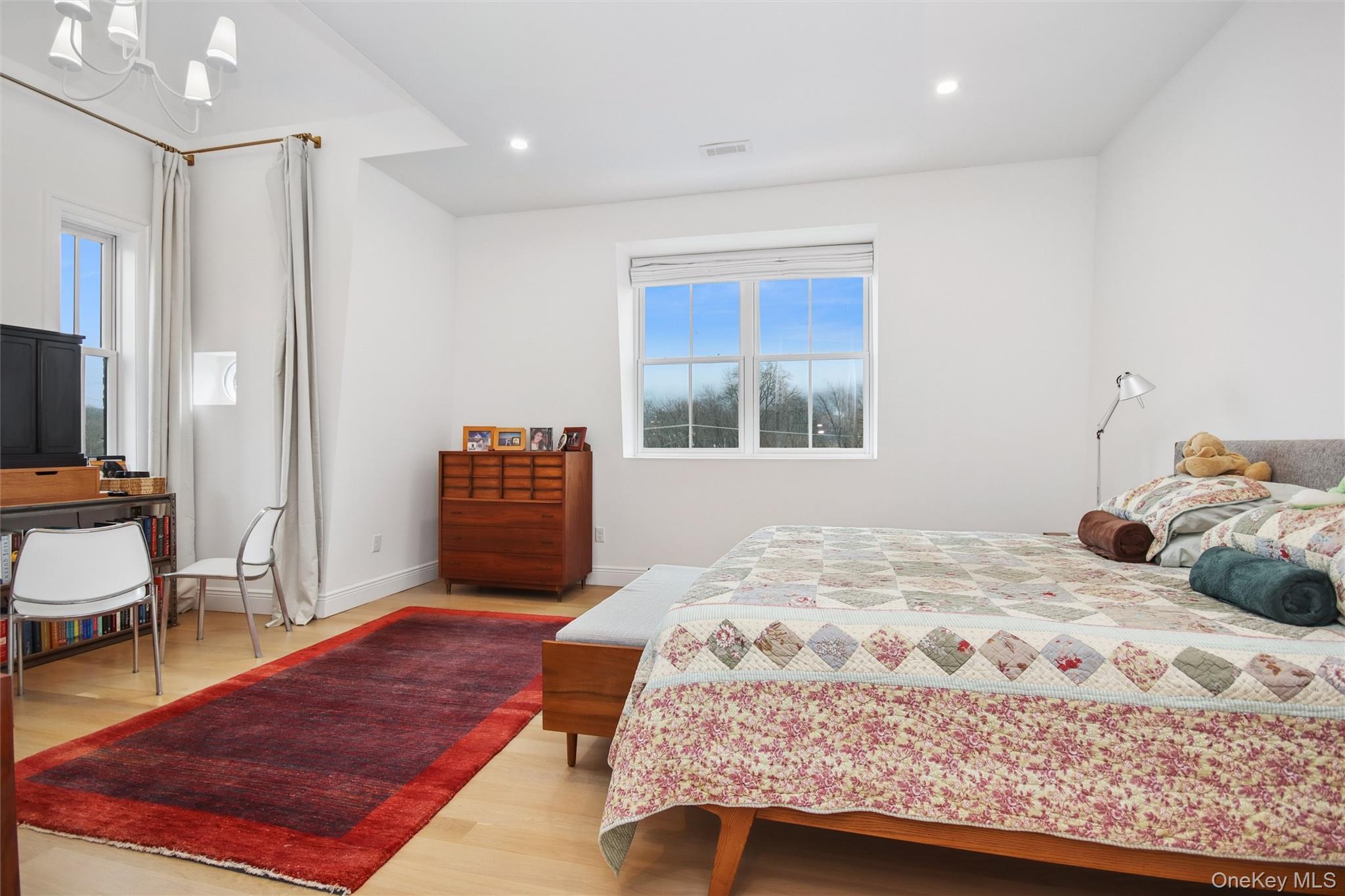 33 Davis Street Beacon, NY 12508 - Photo 29 of 46 a bedroom with a bed and a chair with the view of hallway