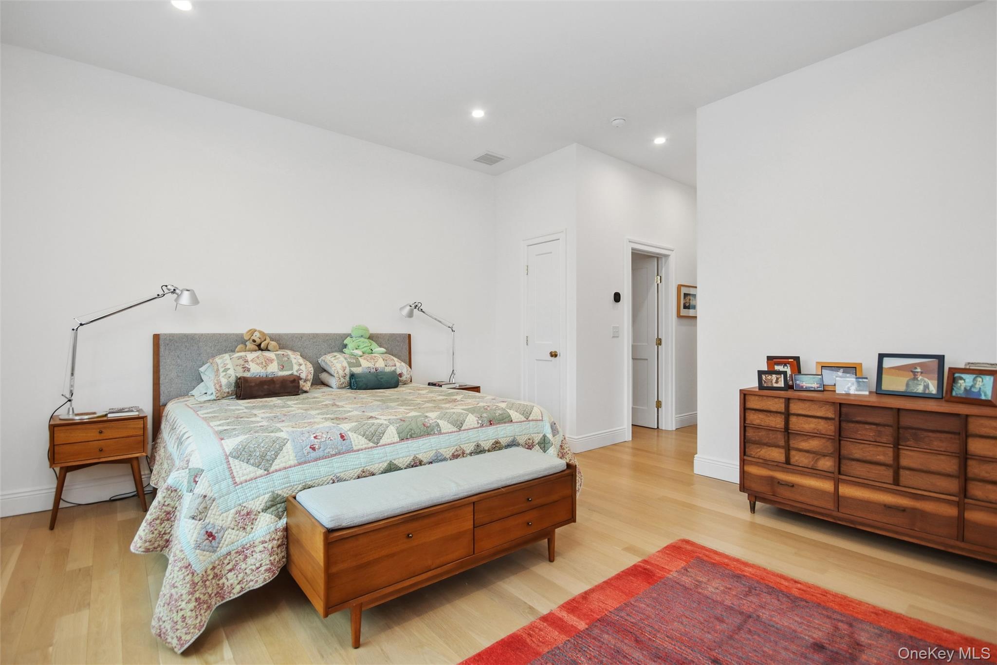 33 Davis Street Beacon, NY 12508 - Photo 30 of 46 a spacious bedroom with a bed and a couch