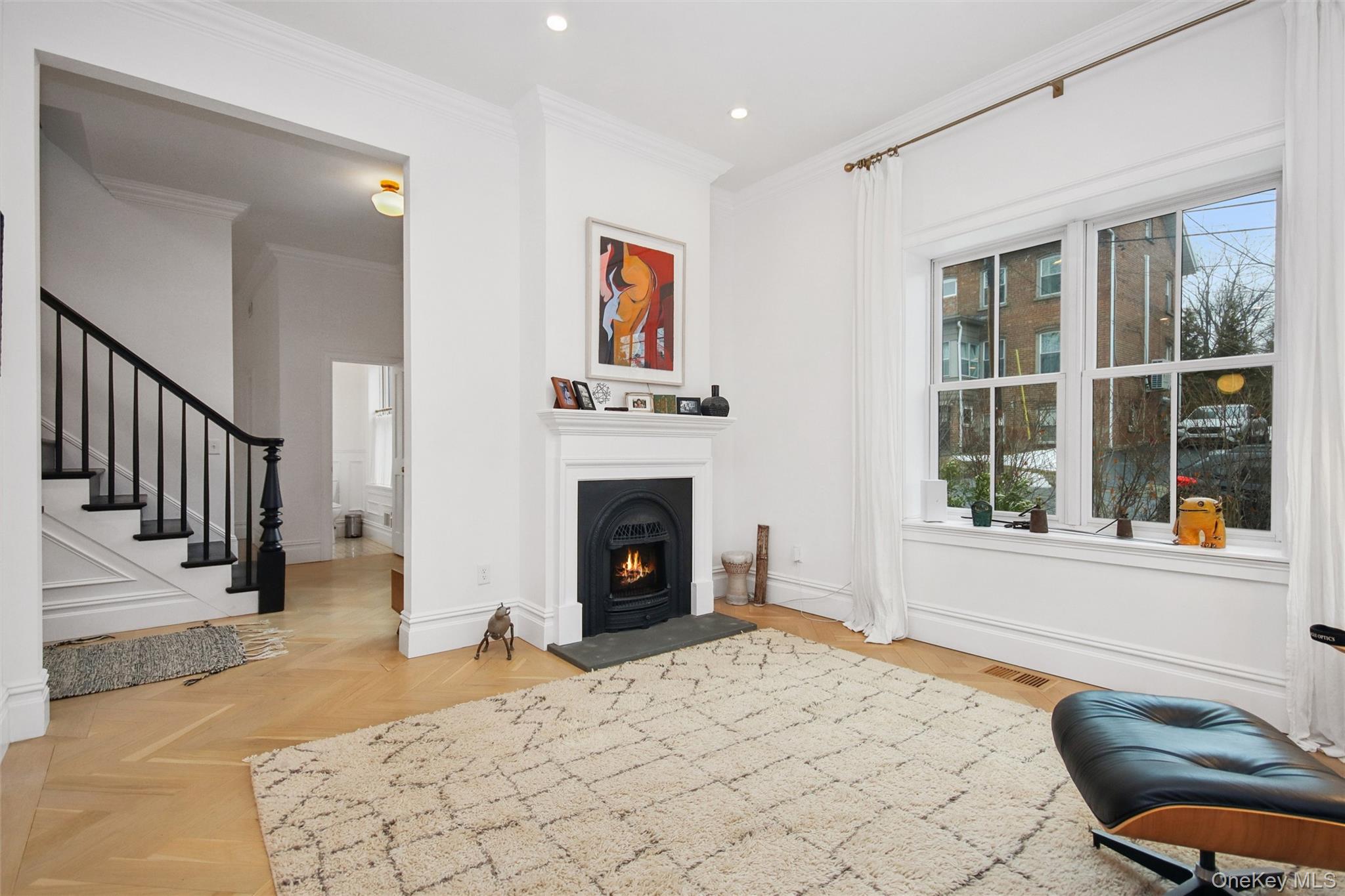 33 Davis Street Beacon, NY 12508 - Photo 6 of 46 a view of a livingroom with a fireplace and workspace