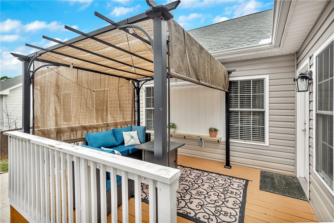 101 Riviera Circle Anderson, SC 29621 - Photo 26 of 35 Enjoy outdoor living on this inviting wooden deck, complete with a covered pergola.