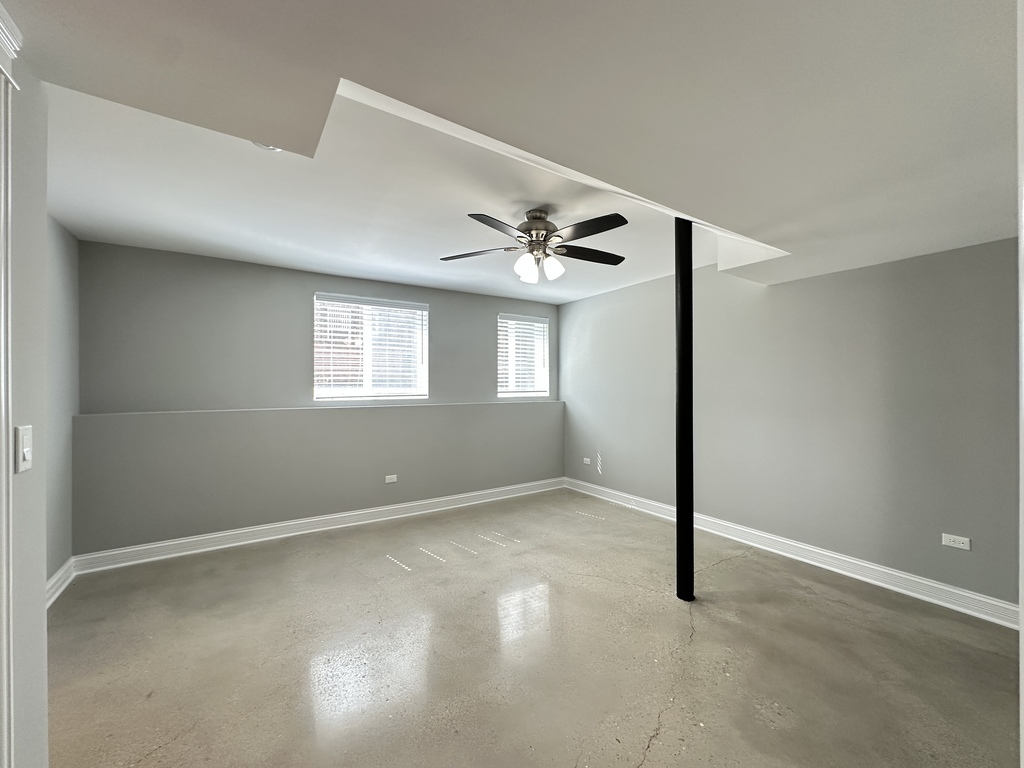 4117 South Michigan Avenue, Unit GS Chicago, IL 60653 - Photo 16 of 20 a view of an empty room with a window
