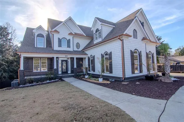 a front view of a house with parking area