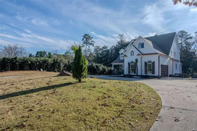 a view of a house with a snow in the yard