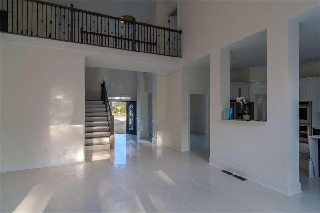4822 Chamblee Dunwoody Road Atlanta, GA 30338 - Photo 19 of 65 wooden floor in a hall with an entryway