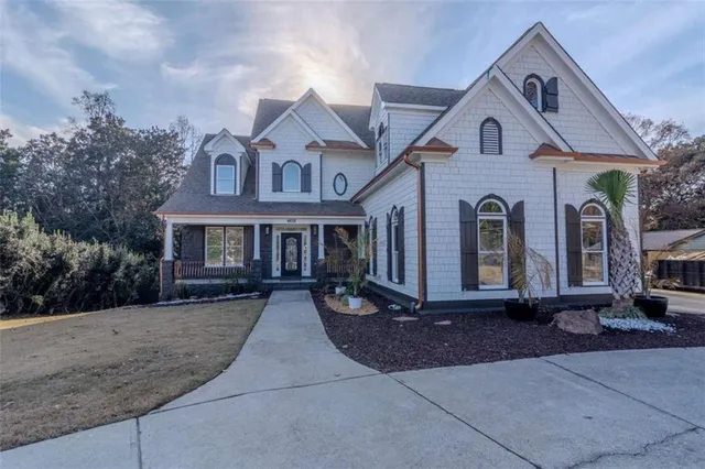 a front view of a house with yard