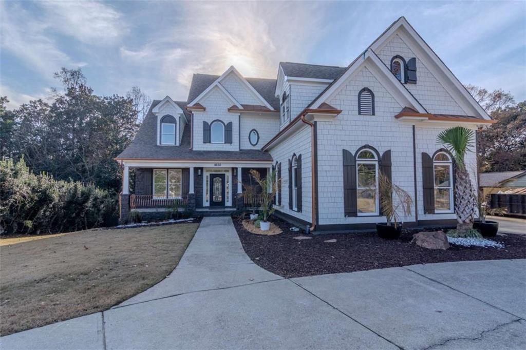 4822 Chamblee Dunwoody Road Atlanta, GA 30338 - Photo 2 of 65 a front view of a house with yard