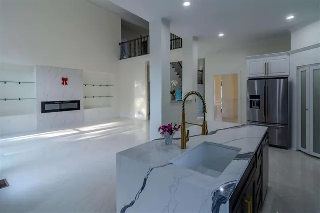 a view of a big room with windows and entryway