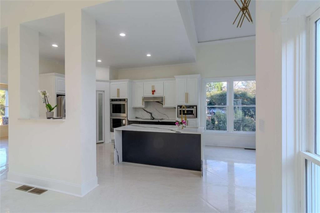4822 Chamblee Dunwoody Road Atlanta, GA 30338 - Photo 25 of 65 a kitchen with stainless steel appliances granite countertop a refrigerator and a sink