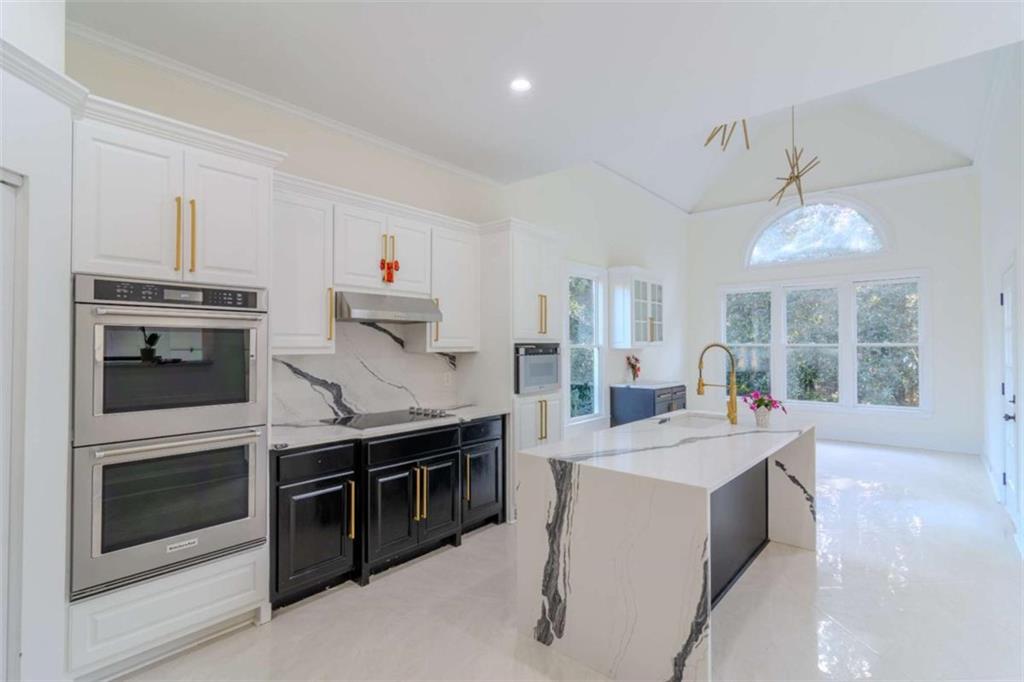 4822 Chamblee Dunwoody Road Atlanta, GA 30338 - Photo 26 of 65 a kitchen with stainless steel appliances granite countertop a stove and a sink