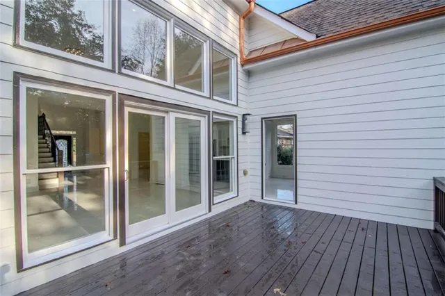a view of a livingroom with a ceiling fan and window