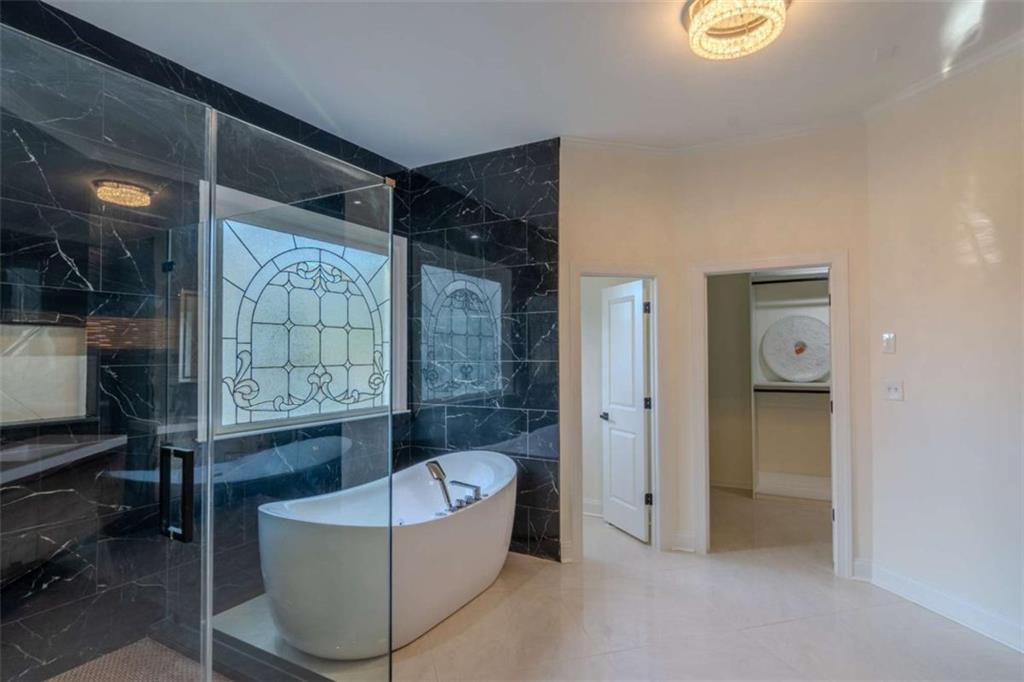 4822 Chamblee Dunwoody Road Atlanta, GA 30338 - Photo 40 of 65 a living room with furniture and a window