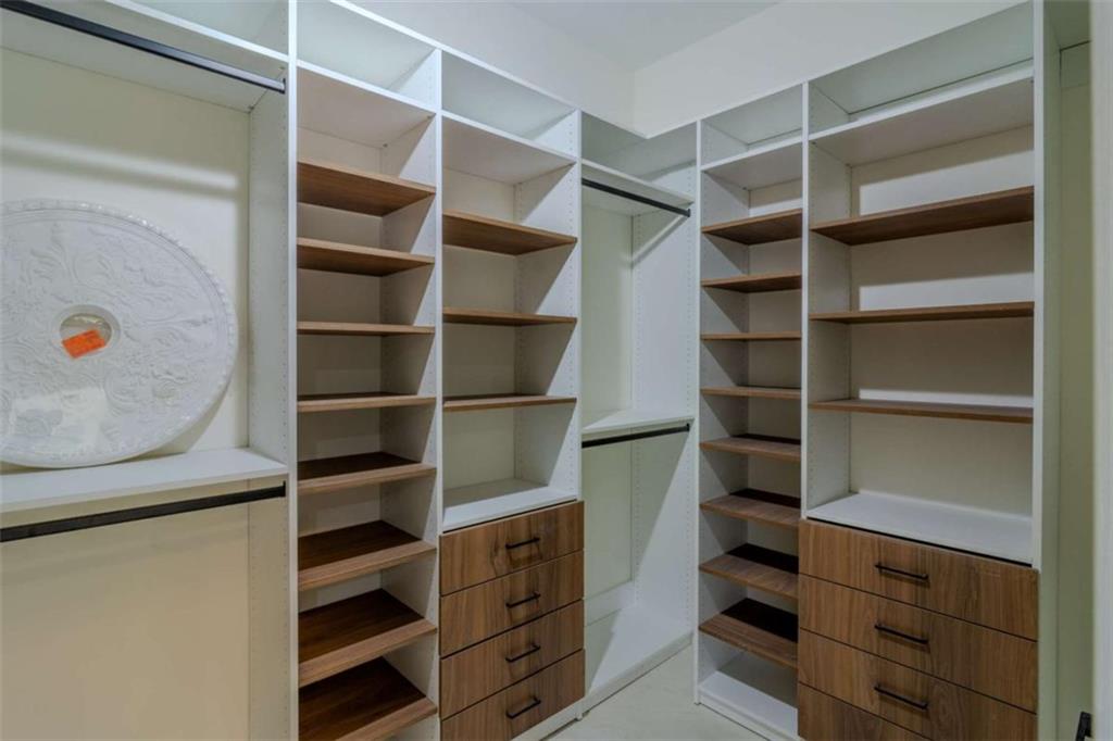 4822 Chamblee Dunwoody Road Atlanta, GA 30338 - Photo 42 of 65 a view of walk in closet with empty racks