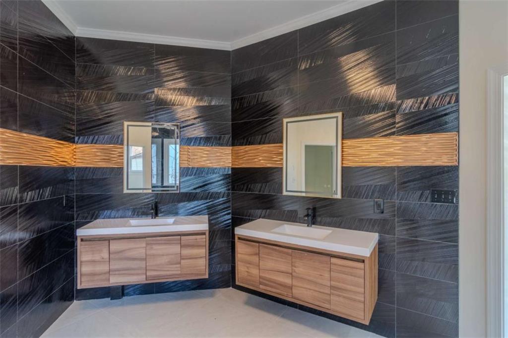 4822 Chamblee Dunwoody Road Atlanta, GA 30338 - Photo 45 of 65 a bathroom with a sink and a mirror