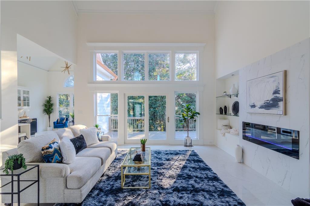 4822 Chamblee Dunwoody Road Atlanta, GA 30338 - Photo 55 of 65 a living room with furniture and a large window