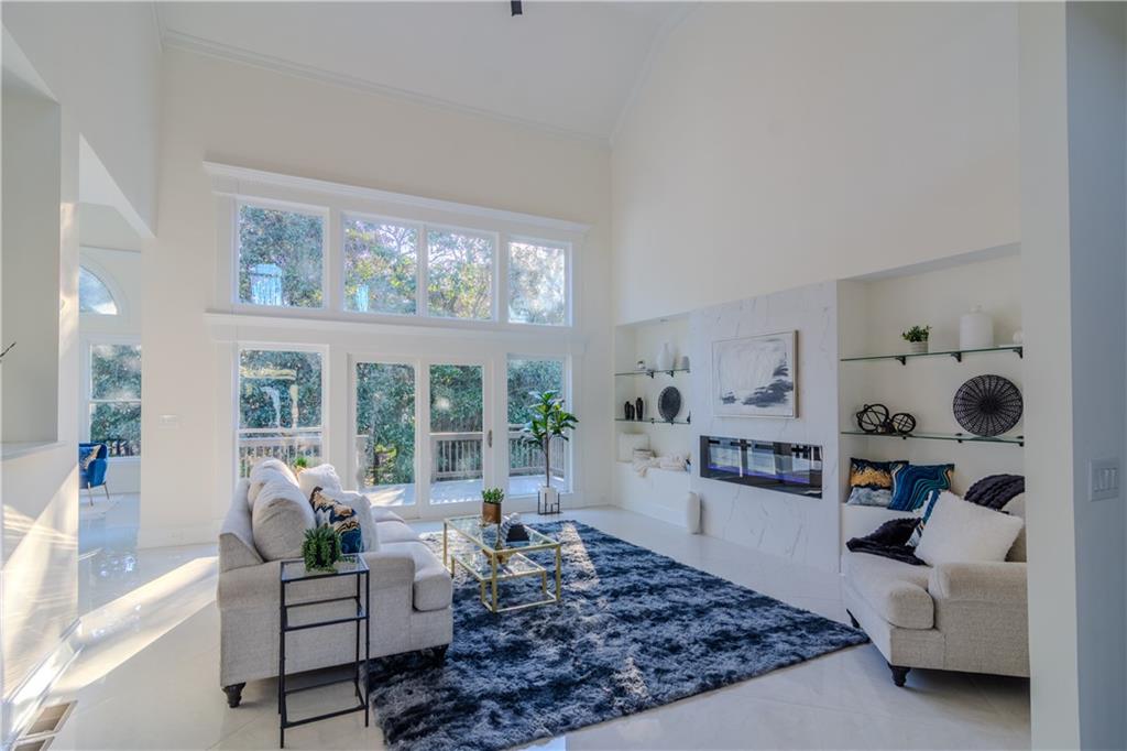 4822 Chamblee Dunwoody Road Atlanta, GA 30338 - Photo 58 of 65 a living room with furniture and a large window