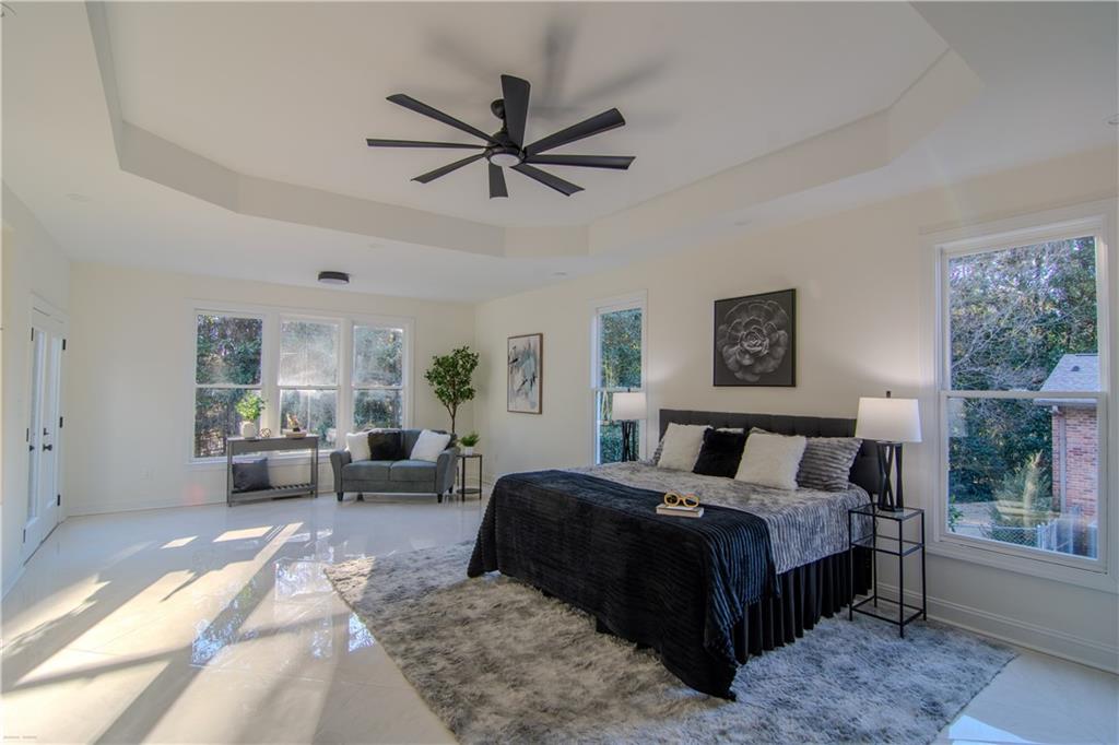 4822 Chamblee Dunwoody Road Atlanta, GA 30338 - Photo 60 of 65 a bedroom with a large bed and a window