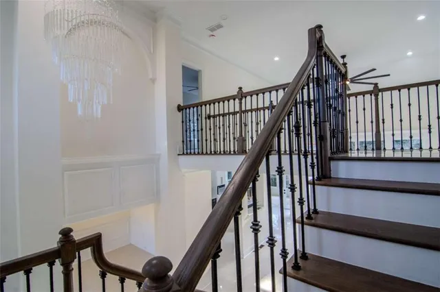 a view of entryway with wooden floor and stairs