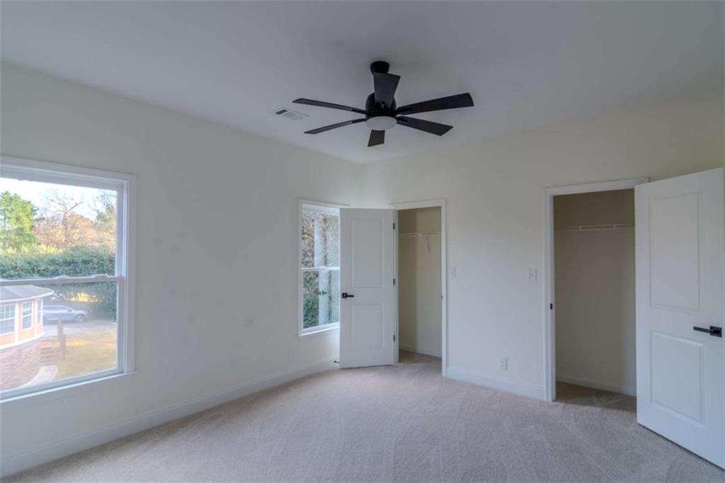 4822 Chamblee Dunwoody Road Atlanta, GA 30338 - Photo 10 of 65 a view of a livingroom with a ceiling fan and window