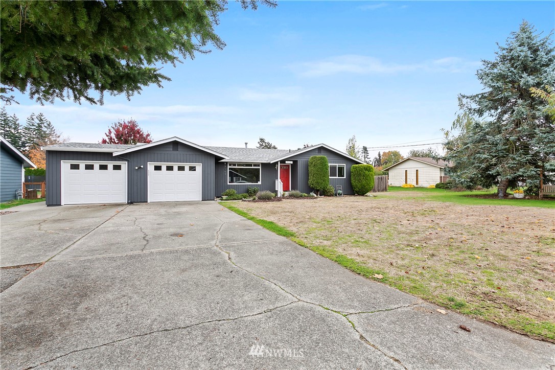 8620 Bender Road Lynden, WA 98264 - Photo 1 of 37 a house view with a garden space