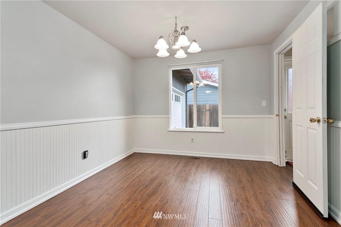 8620 Bender Road Lynden, WA 98264 - Photo 11 of 37 wooden floor in an empty room with a window