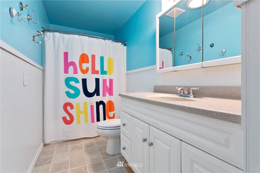 8620 Bender Road Lynden, WA 98264 - Photo 15 of 37 a bathroom with a sink and a mirror