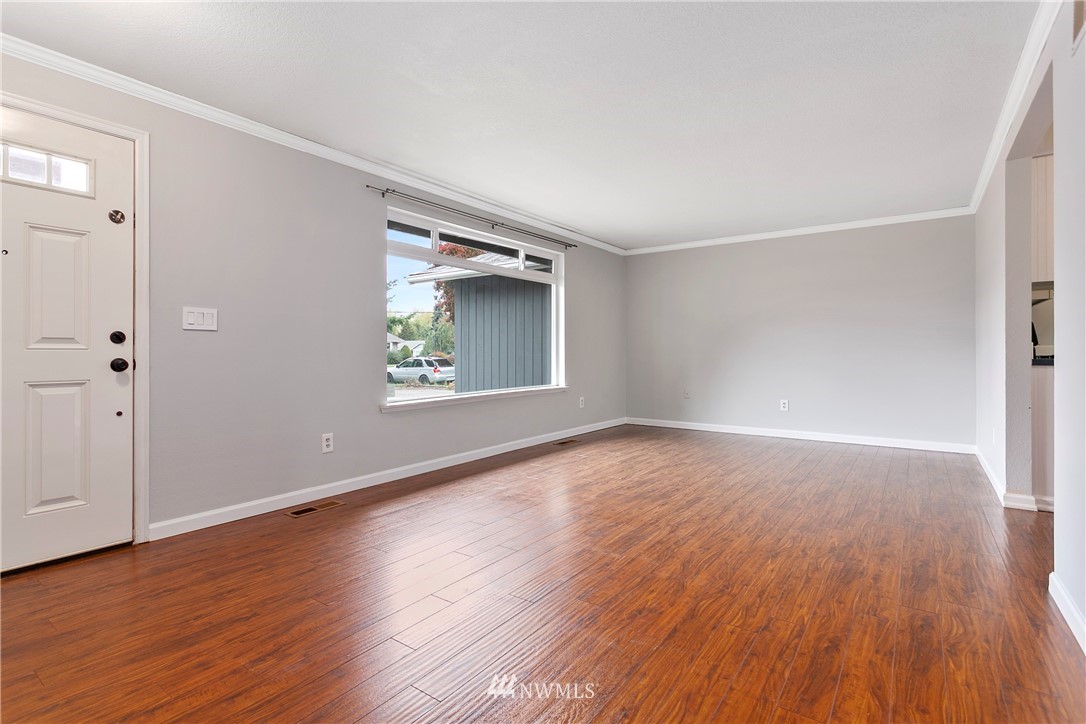 8620 Bender Road Lynden, WA 98264 - Photo 3 of 37 an empty room with wooden floor and windows