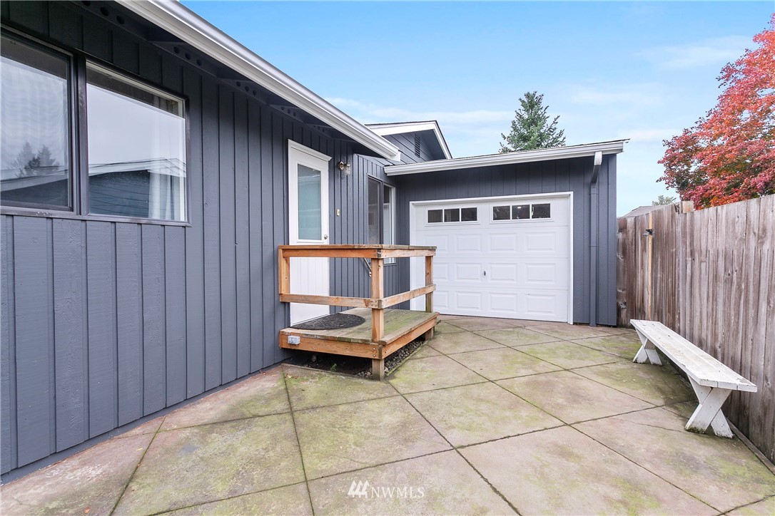 8620 Bender Road Lynden, WA 98264 - Photo 22 of 37 a view of a chairs and table in the back yard of the house