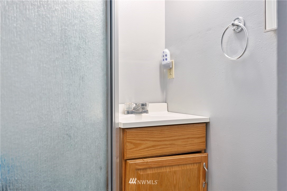 8620 Bender Road Lynden, WA 98264 - Photo 28 of 37 a bathroom with a sink and a mirror