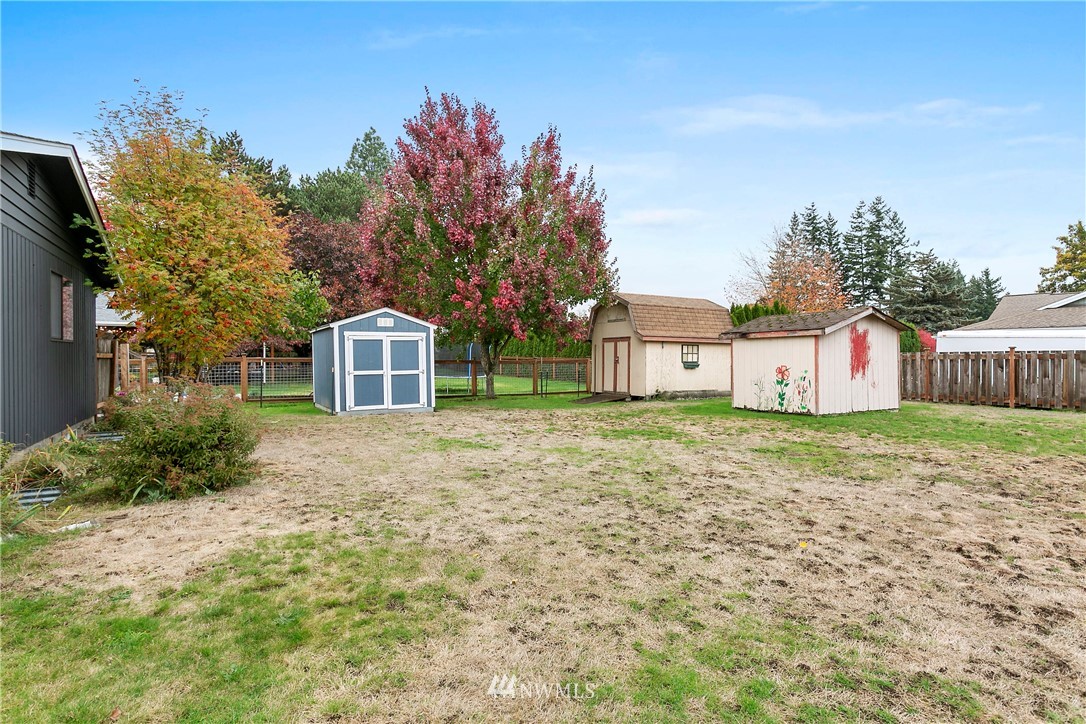 8620 Bender Road Lynden, WA 98264 - Photo 32 of 37 a front view of a house with a yard and garage