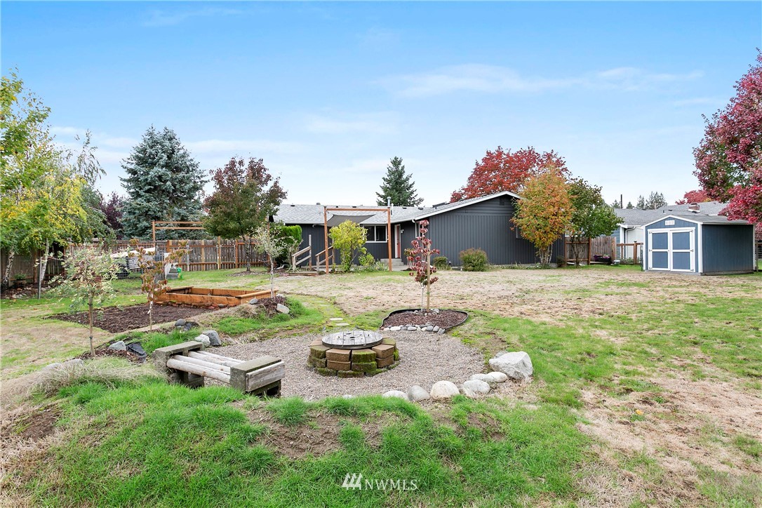 8620 Bender Road Lynden, WA 98264 - Photo 34 of 37 a backyard of a house with table and chairs