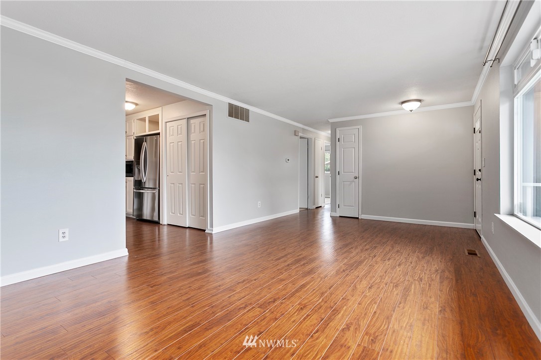 8620 Bender Road Lynden, WA 98264 - Photo 6 of 37 an empty room with wooden floor and windows