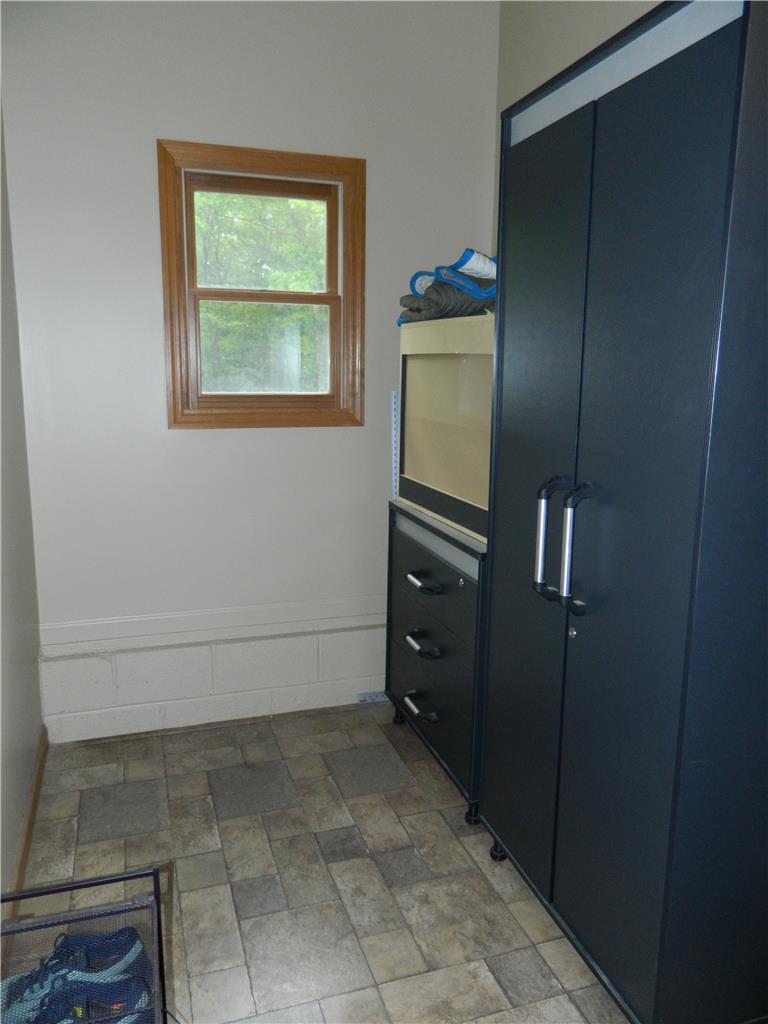 328 Pin Oak Road Stroudsburg, PA 18360 - Photo 20 of 37 Functional utility space with durable tile flooring and a bright window.