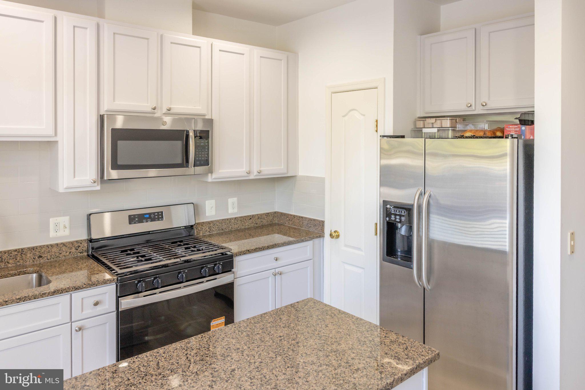 12824 Clarksburg Square Road, Unit 105 Clarksburg, MD 20871 - Photo 35 of 96 Modern kitchen with sleek finishes.