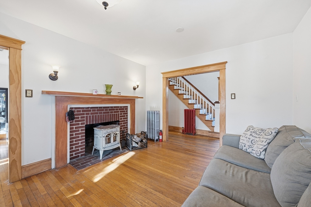 21 High Street Pepperell, MA 01463 - Photo 12 of 40 a living room with furniture and a fireplace