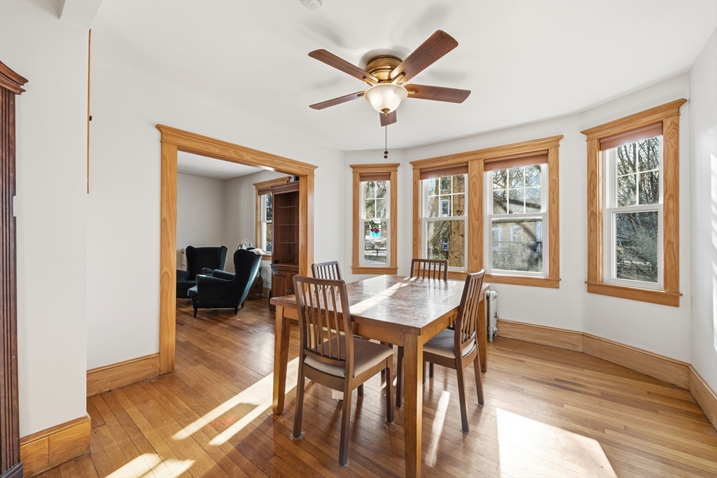 21 High Street Pepperell, MA 01463 - Photo 14 of 40 a dining room with furniture a chandelier and wooden floor