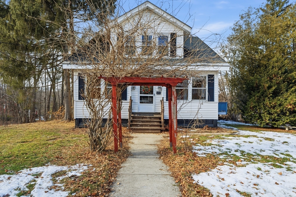 21 High Street Pepperell, MA 01463 - Photo 2 of 40 a front view of a house with a yard