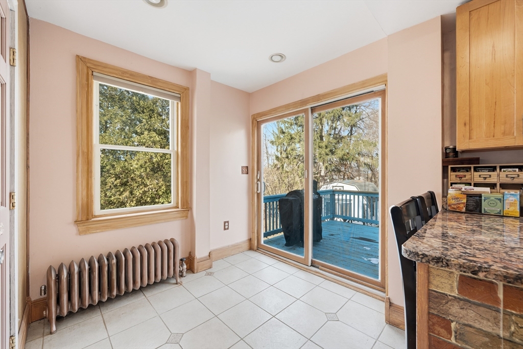 21 High Street Pepperell, MA 01463 - Photo 21 of 40 a kitchen with granite countertop a stove a sink and a refrigerator