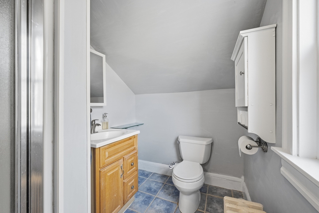 21 High Street Pepperell, MA 01463 - Photo 24 of 40 a bathroom with a toilet sink and mirror