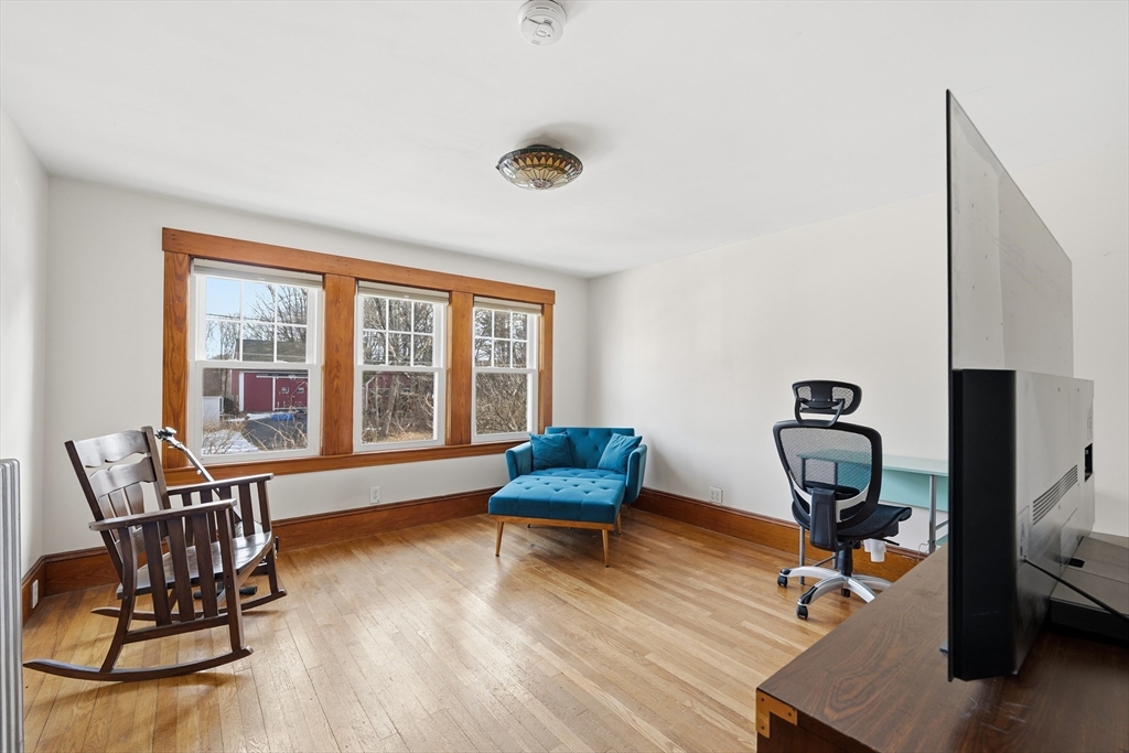 21 High Street Pepperell, MA 01463 - Photo 25 of 40 a bedroom with furniture and a window