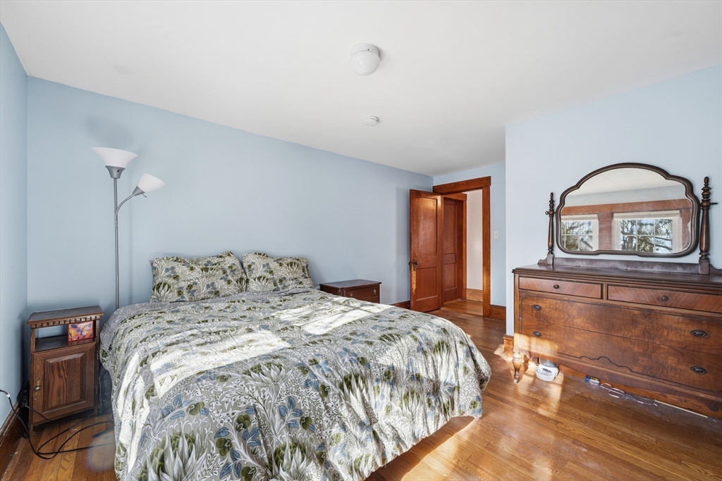 21 High Street Pepperell, MA 01463 - Photo 28 of 40 a bedroom with a large bed and a window