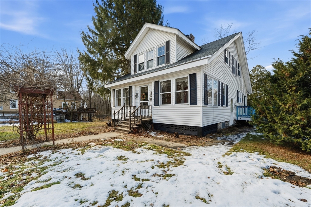 21 High Street Pepperell, MA 01463 - Photo 3 of 40 a view of a house with wooden fence
