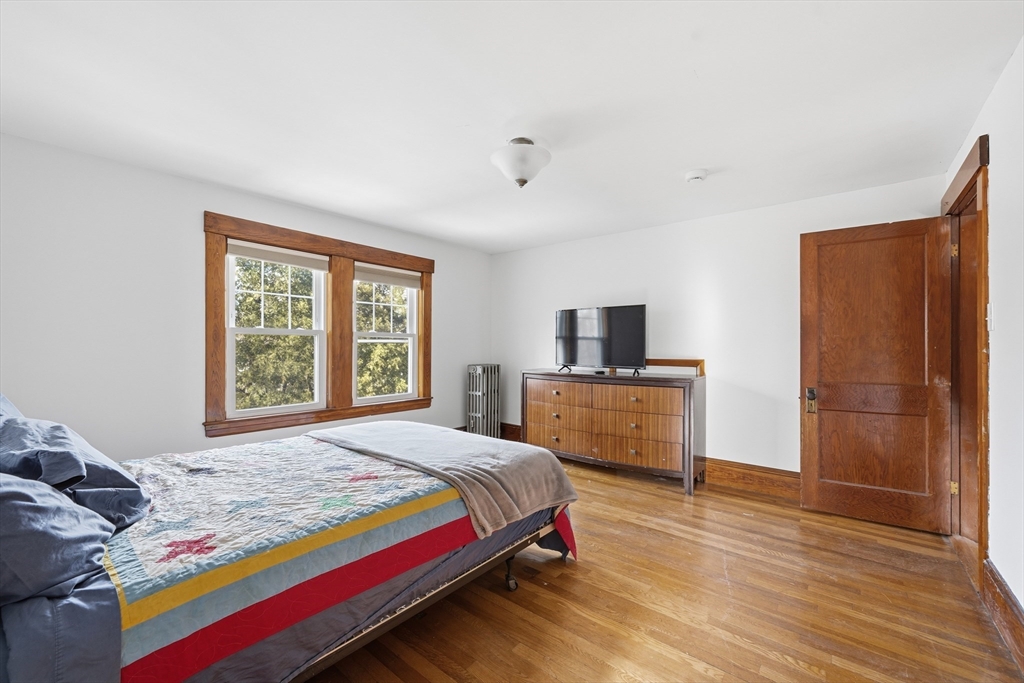 21 High Street Pepperell, MA 01463 - Photo 32 of 40 a bedroom with a bed and a television