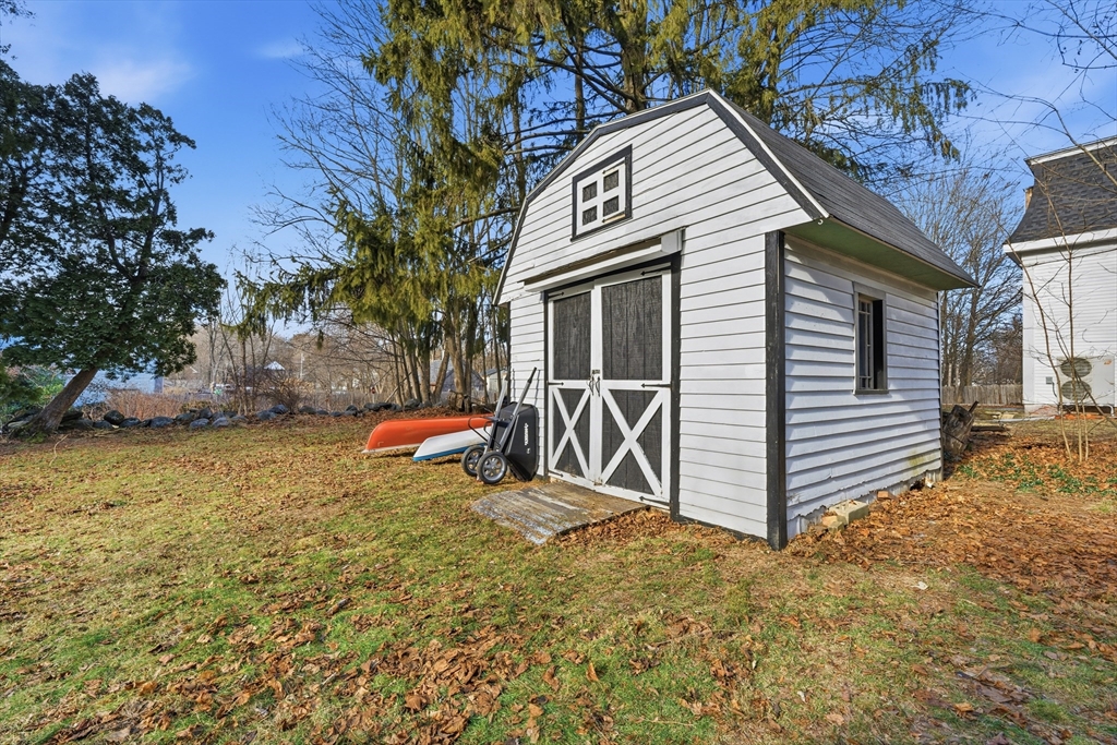 21 High Street Pepperell, MA 01463 - Photo 39 of 40 a view of a house with a yard